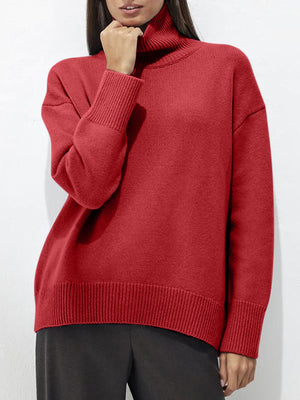 Deep Red acrylic turtleneck sweater with relaxed fit and sculptural sleeves.