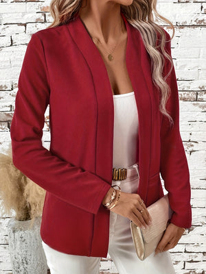 Rust open-front blazer with clean lines and a relaxed fit, styled with a white tank and white pants.