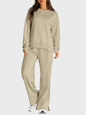 Tan seamed lounge set with crewneck sweatshirt and slit-front wide-leg trousers.