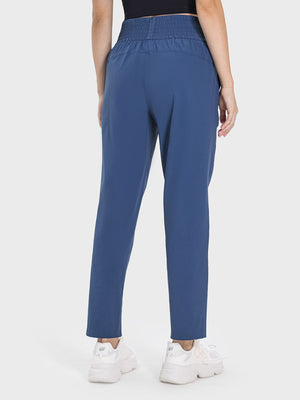 Peacock blue performance trousers with elastic waistband and straight leg