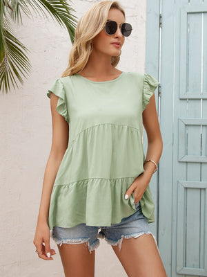 Light green babydoll blouse with ruffled sleeves and tiered hem.