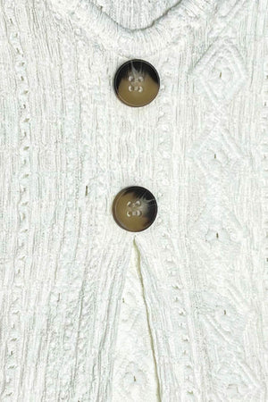 White textured diamond-stitch button-down blouse with tortoise buttons
