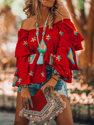 Red embroidered off-shoulder ruffled sleeve shirt with bohemian detailing.