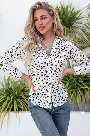 Dalmatian print knot-front shirt in white with black spots, button-up style.