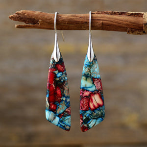 Marbled stone teardrop earrings in red and blue with silver hooks.