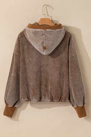 Brown corduroy hoodie with voluminous sleeves and elastic cuffs.