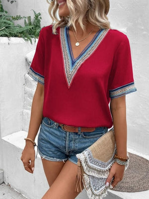 Deep Red V-neck top with embroidered trim on neckline and sleeves