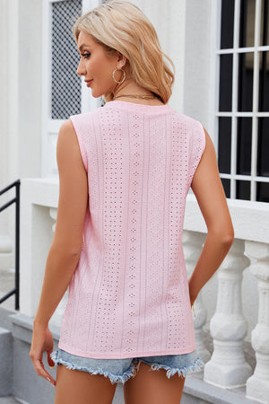 Blush pink perforated sleeveless button-down blouse with eyelet detail.