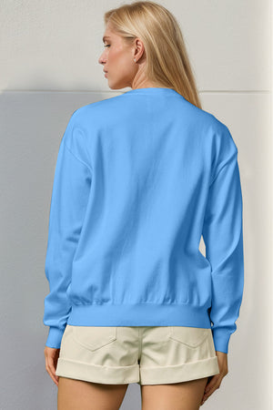 Sky blue crewneck sweater, 100% polyester knit, with long sleeves and ribbed cuffs and hem.