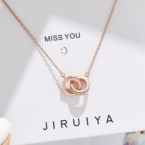 Rose gold double circle pendant necklace with pave crystal accents