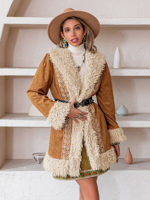 Caramel suede coat with shearling trim and embroidered details.