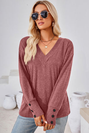 Slouch V-neck top in Rust with button cuffs and long sleeves.
