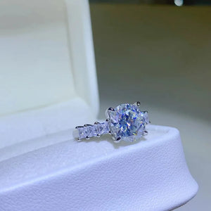 Radiant round moissanite and baguette ring in silver sterling silver.