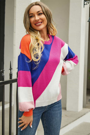 Geometric colorblock knit crewneck sweater in hot pink, blue, white, and orange acrylic blend.