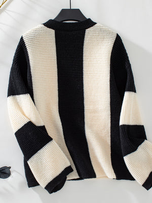 Colorblock stripe knit sweater with waffle texture in black and cream.