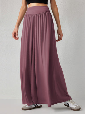 Drape-front wide-leg jersey trousers in Moonlit Mauve with a high waist and flowing silhouette.