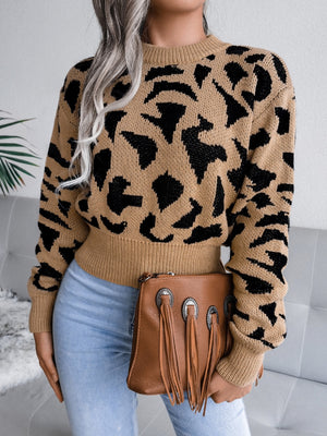 Camel abstract knit cropped sweater with black pattern, crew neck, and ribbed cuffs.