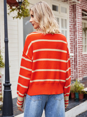 Striped polo neckline knit sweater in orange and tan acrylic, casual chic style.