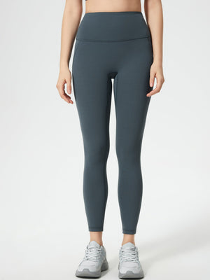 Gray high-waisted leggings with pocket detail and full length.
