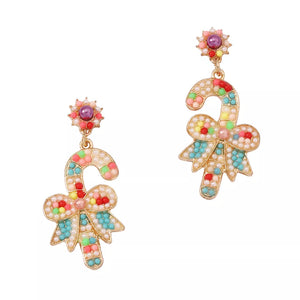 Festive candy cane bow earrings with colorful beads and pearl accents.