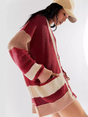 Textured knit cardigan with varsity stripes in scarlet, cream, and tan, featuring a button front and pockets.