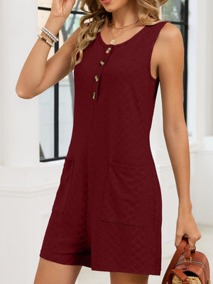 Burgundy buttoned sleeveless romper with textured fabric and patch pockets.
