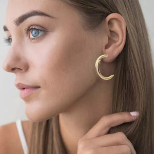 Gold-plated C-hoop earrings with a sculptural, chunky design.