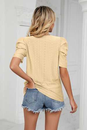 Yellow perforated sleeve volume top with puff sleeves and eyelet detail.