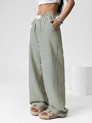 Navy striped high-waisted wide-leg pants with drawstring detail.