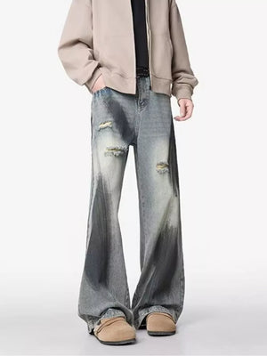 Distressed wide-leg jeans with a belted detail and gradient wash.
