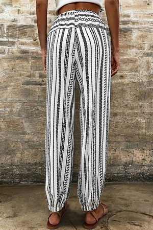 Embroidered stripe drawstring joggers with elastic cuffs and a smocked waistband.