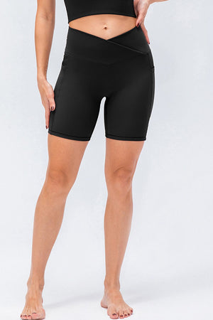 Black cross-waist active bike shorts with side pockets