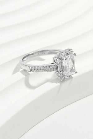 Silver emerald cut halo ring with pave band and baguette accents
