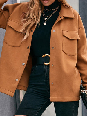Caramel oversized utility jacket with snap closure and chest pockets.