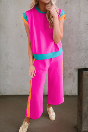 Colorblock sportswear set with contrast trim in hot pink, black, brown, or light blue.
