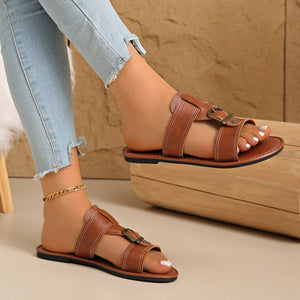 Chic brown pu leather slide sandals with buckled straps and contrast stitching.