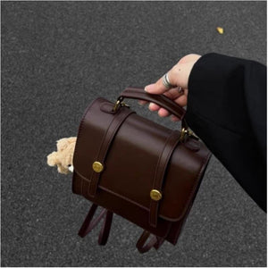 Mini brown pu leather backpack with decorative straps and gold hardware