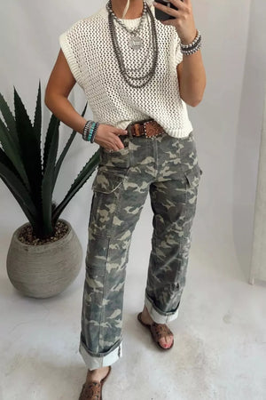 Camo print cargo jeans with cuffed ankles and utility pockets.
