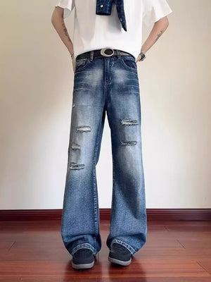 Distressed wide-leg men's jeans in blue denim with pockets and belt loops.