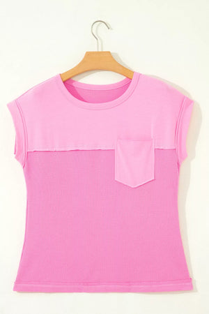 Pink waffled seam pocketed t-shirt with crew neck and short sleeves.