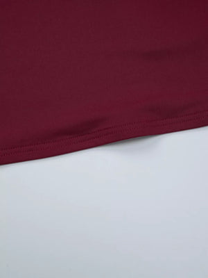Wine red t-shirt with a cropped hem and visible stitching detail.