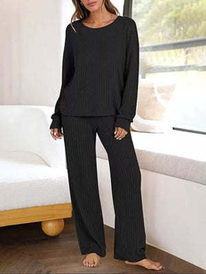 Black ribbed knit lounge set with crew neck top and wide leg pants.