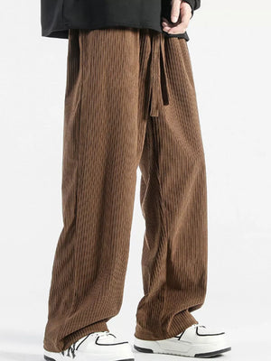 Brown corduroy wide-leg sweatpants with drawstring waist and vertical ribbing.