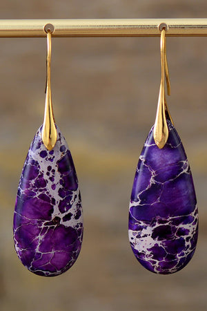 Purple and gold dangle earrings with teardrop-shaped ocean jasper stones.