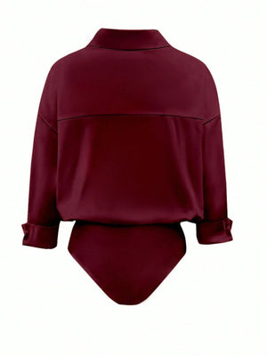 Wine red collared long sleeve bodysuit with button-down detail and cuffed sleeves.