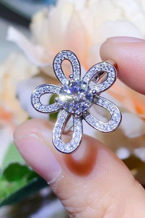 White moissanite flower ring with pavé detail on petals.