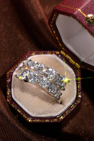 Cascading cluster diamond ring in silver with two rows of sparkling stones.