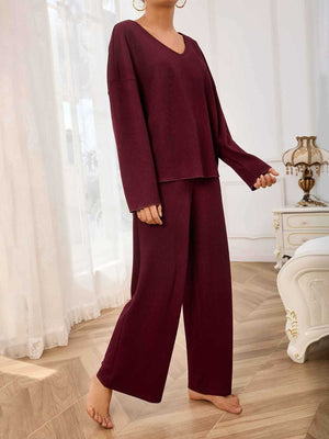 Burgundy textured loungewear set with wide-leg pants and a V-neck top.