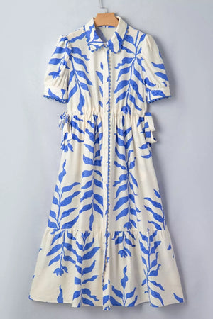 Maxi dress with botanical print, collared neckline, short sleeves, and side ties.