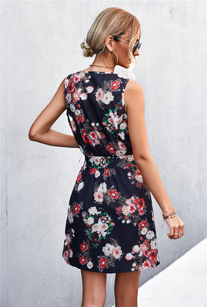 Black floral zip-front mini dress with tie waist and sleeveless design